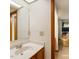 Bright bathroom features a skylight, and a doorway to a bedroom with a yellow chair at 14 Quintin Pl, Durham, NC 27705