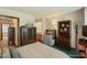 Cozy bedroom boasts built-in display case, hardwood accents, and neutral paint scheme at 14 Quintin Pl, Durham, NC 27705