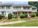 Charming townhouse with neat landscaping, sidewalk and traditional architectural details at 14 Quintin Pl, Durham, NC 27705