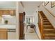 Inviting foyer featuring a staircase, coat closet, and views of the living area at 14 Quintin Pl, Durham, NC 27705
