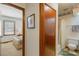 Hallway view to bedroom and bathroom, natural light, and neutral color scheme at 14 Quintin Pl, Durham, NC 27705