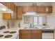 Functional kitchen with ample cabinet space, neutral countertops and a cozy window view at 14 Quintin Pl, Durham, NC 27705