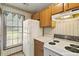 Well-appointed kitchen featuring modern appliances and natural light from the window at 14 Quintin Pl, Durham, NC 27705