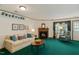 Cozy living room with fireplace, ample natural light, and neutral décor at 14 Quintin Pl, Durham, NC 27705