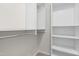 Well-organized walk-in closet with built-in shelving and ample storage space at 144 Greenmont Ln, Cary, NC 27511