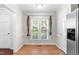 Bright dining area with hardwood floors and a large window at 144 Greenmont Ln, Cary, NC 27511