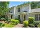 Charming two-story home with manicured landscaping, brick walkway and covered front porch at 144 Greenmont Ln, Cary, NC 27511