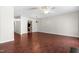Spacious living room with hardwood floors, neutral walls and a chandelier at 144 Greenmont Ln, Cary, NC 27511