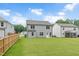 Large backyard with green grass and patio, excellent for outdoor activities and gatherings at 1471 Carlton Links Dr, Fuquay Varina, NC 27526