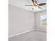 A bright bedroom featuring gray carpet, light grey walls, and a window at 1471 Carlton Links Dr, Fuquay Varina, NC 27526