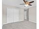 A bedroom featuring gray carpet, a ceiling fan, and a closet with sliding doors at 1471 Carlton Links Dr, Fuquay Varina, NC 27526