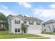 Charming two-story home with gray siding, attached garage, and well-manicured lawn at 1471 Carlton Links Dr, Fuquay Varina, NC 27526