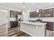 Modern kitchen features granite counters, stainless appliances, and an island with sink at 1471 Carlton Links Dr, Fuquay Varina, NC 27526