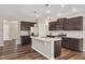 Spacious kitchen with granite island, stainless steel appliances, and ample cabinet space at 1471 Carlton Links Dr, Fuquay Varina, NC 27526