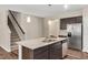 Charming kitchen with a large island, stainless steel appliances, and granite countertops at 1471 Carlton Links Dr, Fuquay Varina, NC 27526