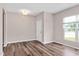 Inviting living room with wood-look floors and a large window at 1471 Carlton Links Dr, Fuquay Varina, NC 27526