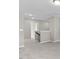 Spacious loft with neutral carpet leading to doorways and a glimpse of an attic access point at 1471 Carlton Links Dr, Fuquay Varina, NC 27526