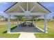 Charming community picnic pavilion with picnic tables and hopscotch, perfect for outdoor dining at 1471 Carlton Links Dr, Fuquay Varina, NC 27526