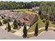 Aerial view showcasing a landscaped home on a corner lot with mature trees at 1523 Anthology Dr, Durham, NC 27703