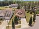 Aerial view of a landscaped home with a spacious driveway and two-car garage at 1523 Anthology Dr, Durham, NC 27703