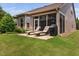 Outdoor patio featuring lounge chairs and a grill, perfect for relaxing and entertaining in the backyard at 1523 Anthology Dr, Durham, NC 27703