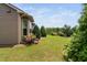 Well-maintained backyard with lush lawn and landscaping, providing a serene outdoor space at 1523 Anthology Dr, Durham, NC 27703