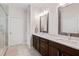 Bathroom showcasing a double vanity with marble countertops and a private toilet room for added convenience at 1523 Anthology Dr, Durham, NC 27703