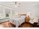 Serene main bedroom features hardwood floors, natural light, and a cozy window seat at 1523 Anthology Dr, Durham, NC 27703