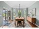 Bright dining room with hardwood floors, natural light, and sliding glass door access at 1523 Anthology Dr, Durham, NC 27703