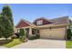 Charming home with a well-manicured lawn, two-car garage, and inviting front porch at 1523 Anthology Dr, Durham, NC 27703