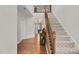 Grand foyer showcasing a staircase with a decorative railing and views into the living spaces of the home at 1523 Anthology Dr, Durham, NC 27703