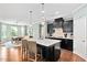 Stylish kitchen with an island, modern lighting, and a view into the dining area at 1523 Anthology Dr, Durham, NC 27703