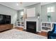 Inviting living room showcases a fireplace with built-in shelving and hardwood floors at 1523 Anthology Dr, Durham, NC 27703