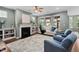 Bright living room boasts a fireplace, large windows, and comfortable seating at 1523 Anthology Dr, Durham, NC 27703