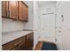 Mudroom featuring granite counters, ample cabinets, and white doors at 1523 Anthology Dr, Durham, NC 27703