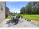 Backyard patio with table and chairs, great for outdoor entertaining at 175 Hawkesburg Dr, Clayton, NC 27527
