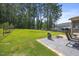 Expansive backyard featuring a basketball hoop on the patio, great for outdoor activities at 175 Hawkesburg Dr, Clayton, NC 27527