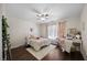 Bedroom with ceiling fan, hardwood floors, and a view to the outside at 175 Hawkesburg Dr, Clayton, NC 27527