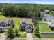 Charming two-story home with a well-manicured lawn and inviting curb appeal at 175 Hawkesburg Dr, Clayton, NC 27527