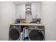 Laundry room with washer, dryer, cabinets, and counter space at 175 Hawkesburg Dr, Clayton, NC 27527