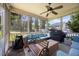 Relaxing screened porch with comfortable seating and ceiling fan at 175 Hawkesburg Dr, Clayton, NC 27527