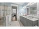 Elegant bathroom with double vanity, white marble flooring, and glass-enclosed shower at 175 Stonecrest Way, Pittsboro, NC 27312