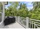 Deck with wooded view and a covered grill at 175 Stonecrest Way, Pittsboro, NC 27312