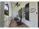 Cozy porch with rocking chairs, brick floor, and ceiling fan at 175 Stonecrest Way, Pittsboro, NC 27312