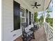 Welcoming porch with rocking chairs, brick floor, and serene outdoor setting at 175 Stonecrest Way, Pittsboro, NC 27312