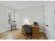 Bright home office with wooden desk, neutral walls, and natural light from the window at 175 Stonecrest Way, Pittsboro, NC 27312