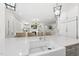 Kitchen with large island, seating, and open floor plan to the living room with built-in shelving and fireplace at 175 Stonecrest Way, Pittsboro, NC 27312