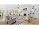 Cozy living room with fireplace, built-in shelves, and hardwood floors at 175 Stonecrest Way, Pittsboro, NC 27312