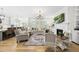 Spacious living room featuring a fireplace, built-in shelving, and a large window at 175 Stonecrest Way, Pittsboro, NC 27312