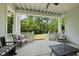 Covered porch with seating overlooking the backyard at 175 Stonecrest Way, Pittsboro, NC 27312